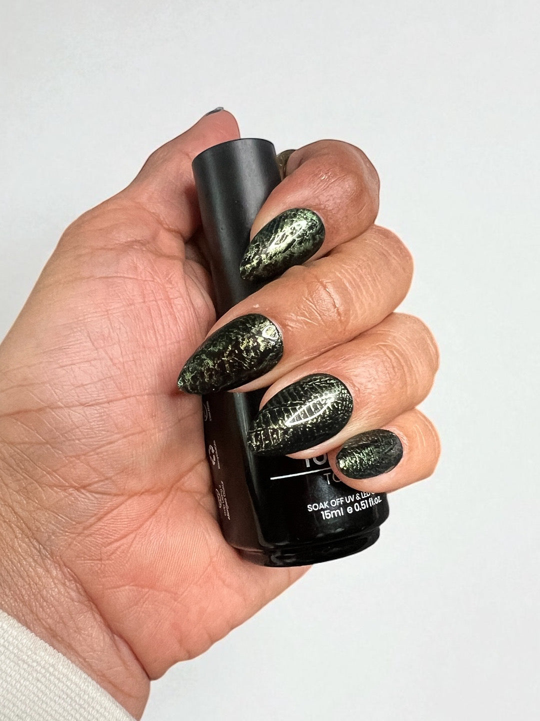 Shadow Venom: shown in Short almond, a dark glitzy green snake print over black