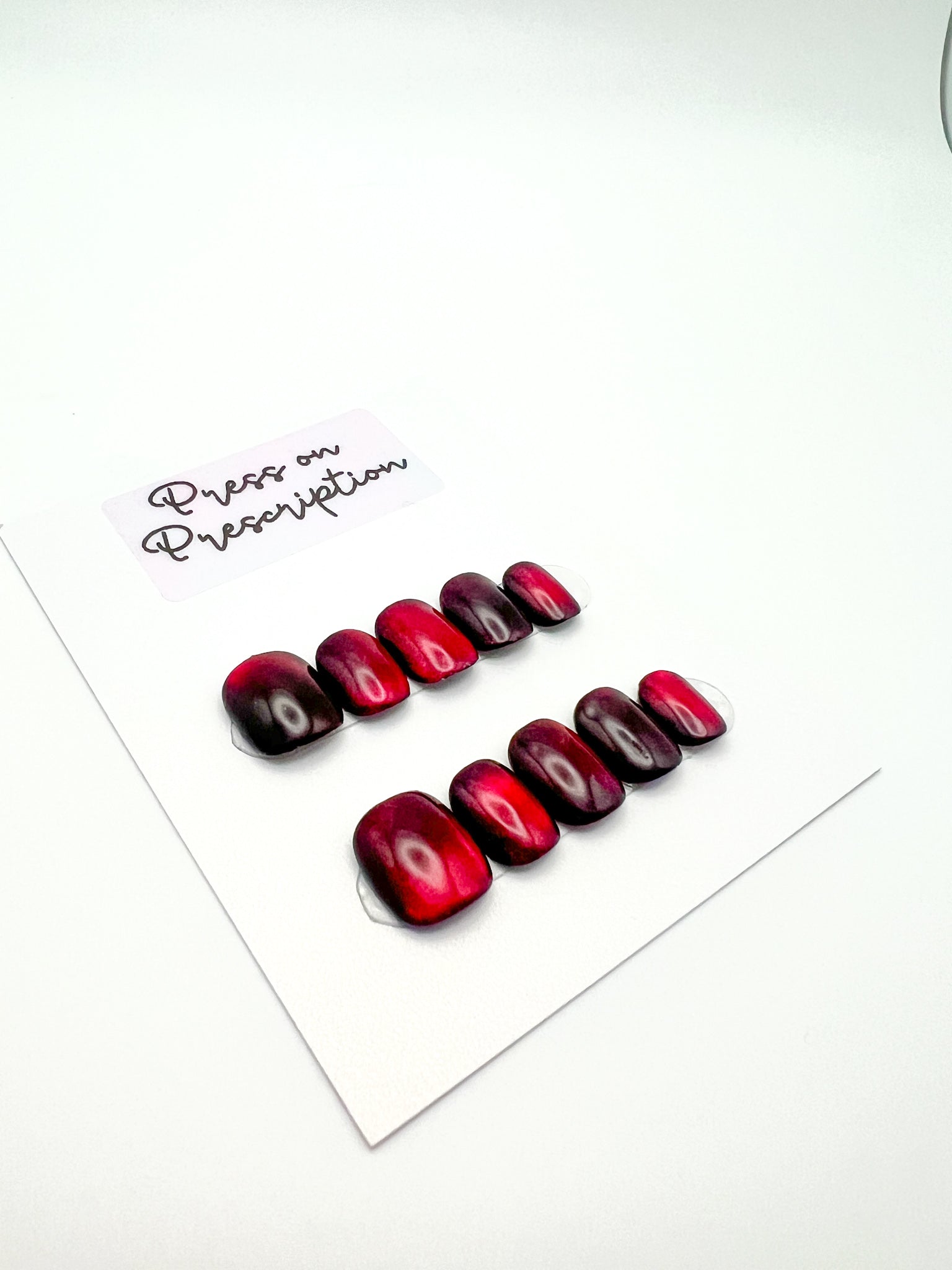 Bloody Eclipse: deep red + cat eye, shown in XS Round/Squoval