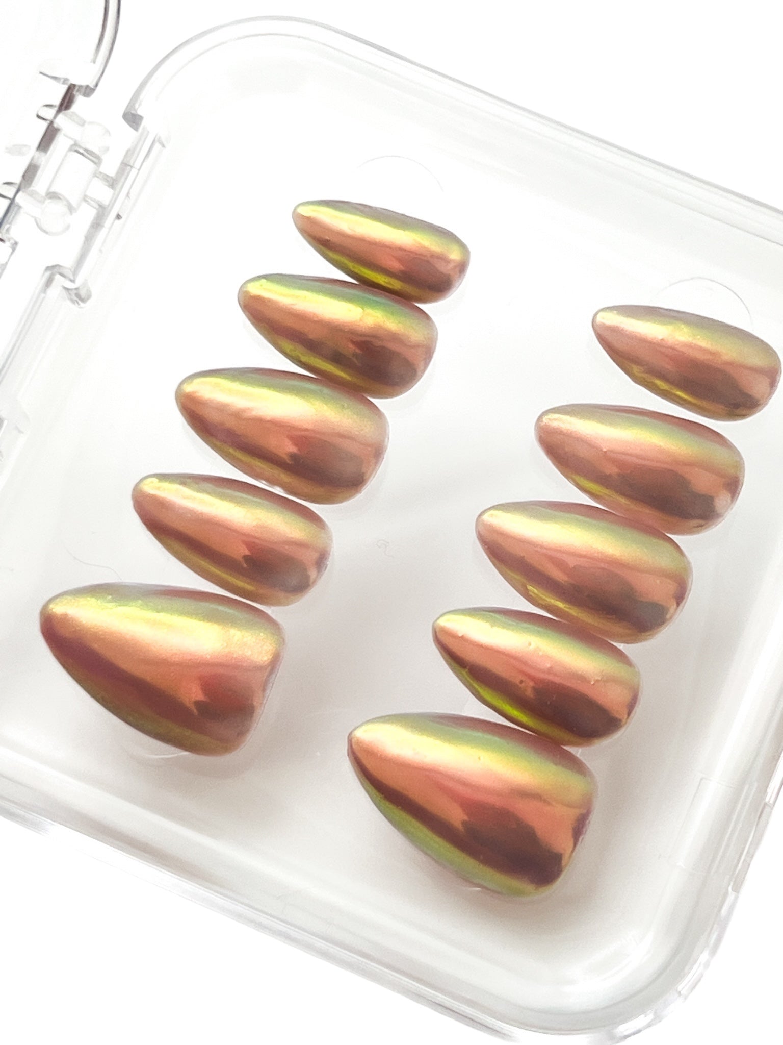 Harvest Glow: a beautiful aura chrome over a taupe polish, shown on Short Almond